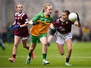 14 July 2024; Eibhlín McCarthy, Scoil Mhuire agus Naomh Treasa, Kerry, representing Galway, in action against Molly Maher, Scoil an Chroí Ró-Naofa, Urlingford, Kilkenny, representing Donegal, during the GAA INTO Cumann na mBunscol Respect Exhibition Go Games at the GAA Football All-Ireland Senior Championship semi-final match between Donegal and Galway at Croke Park in Dublin. Photo by Seb Daly/Sportsfile