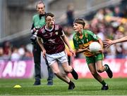 14 July 2024; Dáire McGlone, St Trea's PS, Ballymaguigan, Derry, representing Donegal in action against Eoin O'Hora, Breaffy NS, Ballina, Mayo, representing Galway during the GAA INTO Cumann na mBunscol Respect Exhibition Go Games at the GAA Football All-Ireland Senior Championship semi-final match between Donegal and Galway at Croke Park in Dublin. Photo by Piaras Ó Mídheach/Sportsfile