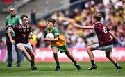 14 July 2024; Dáire McGlone, St Trea's PS, Ballymaguigan, Derry, representing Donegal in action against Eoin O'Hora, Breaffy NS, Ballina, Mayo, representing Galway, left, and Cónal Flynn, Creagh NS, Ballinasloe, Roscommon, representing Galway during the GAA INTO Cumann na mBunscol Respect Exhibition Go Games at the GAA Football All-Ireland Senior Championship semi-final match between Donegal and Galway at Croke Park in Dublin. Photo by Piaras Ó Mídheach/Sportsfile