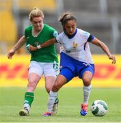 16 July 2024; Selma Bacha of France is tackled by Aoife Mannion of Republic of Ireland during the 2025 UEFA Women's European Championship qualifying group A match between Republic of Ireland and France at Páirc Uí Chaoimh in Cork. Photo by Stephen McCarthy/Sportsfile