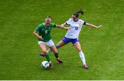 16 July 2024; Ruesha Littlejohn of Republic of Ireland is tackled by Léa Le Garrec of France during the 2025 UEFA Women's European Championship qualifying group A match between Republic of Ireland and France at Páirc Uí Chaoimh in Cork. Photo by Shauna Clinton/Sportsfile