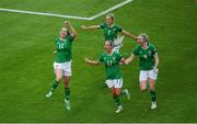 16 July 2024; Anna Patten of Republic of Ireland, 12, celebrates with teammates Julie-Ann Russell, Lily Agg and Louise Quinn after scoring their side's third goal during the 2025 UEFA Women's European Championship qualifying group A match between Republic of Ireland and France at Páirc Uí Chaoimh in Cork. Photo by Shauna Clinton/Sportsfile