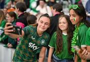 16 July 2024; Jess Ziu of Republic of Ireland takes a selfie with supporters after the 2025 UEFA Women's European Championship qualifying group A match between Republic of Ireland and France at Páirc Uí Chaoimh in Cork. Photo by Stephen McCarthy/Sportsfile