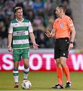 16 July 2024; Daniel Cleary of Shamrock Rovers protests to referee Jarred Gillett, after teammate Jack Byrne, not pictured received a red card, during the UEFA Champions League first qualifying round second leg match between Shamrock Rovers and Vikingur Reykjavik at Tallaght Stadium in Dublin. Photo by Harry Murphy/Sportsfile