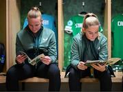 16 July 2024; Republic of Ireland's Jessie Stapleton, right, and and goalkeeper Courtney Brosnan read the match programme in their dressing room before the 2025 UEFA Women's European Championship qualifying group A match between Republic of Ireland and France at Páirc Uí Chaoimh in Cork. Photo by Stephen McCarthy/Sportsfile