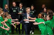 16 July 2024; Republic of Ireland head coach Eileen Gleeson is greeted by the player escorts before the 2025 UEFA Women's European Championship qualifying group A match between Republic of Ireland and France at Páirc Uí Chaoimh in Cork. Photo by Stephen McCarthy/Sportsfile