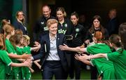 16 July 2024; Republic of Ireland head coach Eileen Gleeson is greeted by the player escorts before the 2025 UEFA Women's European Championship qualifying group A match between Republic of Ireland and France at Páirc Uí Chaoimh in Cork. Photo by Stephen McCarthy/Sportsfile