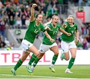 16 July 2024; Republic of Ireland's Anna Patten, left, celebrates after scoring her side's third goal with team-mates Lily Agg and Louise Quinn, right, during the 2025 UEFA Women's European Championship qualifying group A match between Republic of Ireland and France at Páirc Uí Chaoimh in Cork. Photo by Stephen McCarthy/Sportsfile