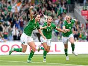 16 July 2024; Republic of Ireland's Anna Patten, left, celebrates after scoring her side's third goal with team-mates Lily Agg and Louise Quinn, right, during the 2025 UEFA Women's European Championship qualifying group A match between Republic of Ireland and France at Páirc Uí Chaoimh in Cork. Photo by Stephen McCarthy/Sportsfile