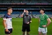 14 July 2024; Referee Conor Dourneen tosses a coin between the two captains Dylan Curran of New York and Ryan Forde of London  before the GAA Football All-Ireland Junior Championship final between London and New York at Croke Park in Dublin. Photo by Ray McManus/Sportsfile