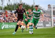 19 July 2024; Cian Byrne of Bohemians in action against Aaron Greene, right, and Darragh Nugent of Shamrock Rovers during the Sports Direct Men’s FAI Cup second round match between Bohemians and Shamrock Rovers at Dalymount Park in Dublin. Photo by Stephen McCarthy/Sportsfile