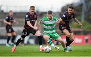 19 July 2024; Jack Byrne of Shamrock Rovers in action against Ross Tierney, left, and Dawson Devoy of Bohemians during the Sports Direct Men’s FAI Cup second round match between Bohemians and Shamrock Rovers at Dalymount Park in Dublin. Photo by Stephen McCarthy/Sportsfile