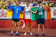 19 July 2024; Cian Crampton of Ireland, right, alongside silver medallist Yaroslav Lystopad of Ukraine, left, and gold medallist Jakub Rodziak of Poland, after winning bronze in the Men's Discus Throw (1.5kg) Final during day two of the European U18 Athletics Championships at the National Athletics Stadium in Banská Bystrica, Slovakia. Photo by Coen Schilderman/Sportsfile