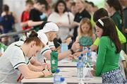 20 July 2024; Danielle Hill signs her autograph for a young supporter during a Team Ireland Paris 2024 Aquatics team training session at the National Aquatic Centre on the Sport Ireland Campus in Dublin. Photo by Seb Daly/Sportsfile
