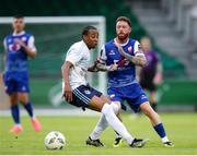 19 July 2024; Adetobi Jinadu of Kilbarrack United in action against Lee J Lynch of Treaty United during the Sports Direct Men’s FAI Cup second round match between Treaty United and Kilbarrack United at Markets Field in Limerick. Photo by Michael P Ryan/Sportsfile
