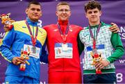 20 July 2024; Men's discus throw medallists, Jakub Rodziak of Poland, gold, centre, Yaroslav Lystopad of Ukraine, silver, left, and Cian Crampton of Ireland, bronze, right, during day three of the European U18 Athletics Championships at the National Athletics Stadium in Banská Bystrica, Slovakia. Photo by Coen Schilderman/Sportsfile