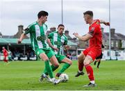 21 July 2024; John Martin of Shelbourne in action against Harry Groome, left, and Max Murphy of Bray Wanderers during the Sports Direct Men’s FAI Cup second round match between Bray Wanderers and Shelbourne at Carlisle Grounds in Bray, Wicklow. Photo by Thomas Flinkow/Sportsfile