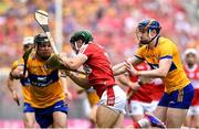 21 July 2024; Mark Coleman of Cork is tackled by Clare players from left, Cathal Malone and David Fitzgerald during the GAA Hurling All-Ireland Senior Championship Final between Clare and Cork at Croke Park in Dublin. Photo by John Sheridan/Sportsfile