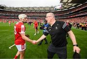 21 July 2024; Clare manager Brian Lohan shakes hands with Patrick Horgan of Cork after the GAA Hurling All-Ireland Senior Championship Final between Clare and Cork at Croke Park in Dublin. Photo by Stephen McCarthy/Sportsfile