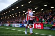 21 July 2024; Michael Duffy of Derry City, right, celebrates with teammate Ben Doherty after scoring their side's third goal during the Sports Direct Men’s FAI Cup second round match between Derry City and St Patrick’s Athletic at the Ryan McBride Brandywell Stadium in Derry. Photo by Ben McShane/Sportsfile