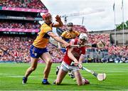 21 July 2024; Tim O'Mahony of Cork tries to clear under pressure from Peter Duggan of Clare during the GAA Hurling All-Ireland Senior Championship Final between Clare and Cork at Croke Park in Dublin. Photo by Piaras Ó Mídheach/Sportsfile