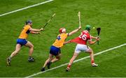 21 July 2024; Robbie O'Flynn of Cork takes a shot despite the challenge of Conor Leen of Clare which subsequently went wide near the end of the GAA Hurling All-Ireland Senior Championship Final between Clare and Cork at Croke Park in Dublin. Photo by Daire Brennan/Sportsfile