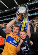 21 July 2024; Shane O'Donnell of Clare celebrates with the Liam MacCarthy cup and supporter David Moloney after the GAA Hurling All-Ireland Senior Championship Final between Clare and Cork at Croke Park in Dublin. Photo by Stephen McCarthy/Sportsfile