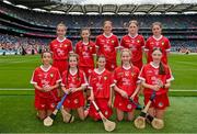 21 July 2024; The Cork team, backrow from left, Paige Russell, Holy Trinity SNS, Donaghmeade, Dublin, Sophie Bridgeman, St Fiachra's SNS, Beaumont, Dublin, Annie Rose Hogan, Coolderry NS, Birr, Offaly, Kallie Herbert, Lanesboro NS, Lanesboro, Longford, and Niamh McGarry, St Mary's PS, Portaferry, Down, and front row from left, Millie Allen, Riverstown NS, Glanmire, Cork, Sadhbh Spillane, Abbeydorney NS, Abbeydorney, Kerry, Fia Conroy, Scoil an Fhraoich Mhóir, Portlaoise, Laois, Amelia O'Donovan, Glenville NS, Glenville, Cork, and Emma Kelly, Church Hill NS, Cuffesgrange, Kilkenny, before the GAA INTO Cumann na mBunscol Respect Exhibition Go Games at the GAA Hurling All-Ireland Senior Championship final between Clare and Cork at Croke Park in Dublin. Photo by Sam Barnes/Sportsfile