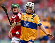 21 July 2024; Darragh Pettitt, Murrintown NS, Murrintown, Wexford, representing Clare, in action against Shay Mallie, Scoil Mhuire na mBuachaillí, Monaghan, representing Cork, during the GAA INTO Cumann na mBunscol Respect Exhibition Go Games at the GAA Hurling All-Ireland Senior Championship final between Clare and Cork at Croke Park in Dublin. Photo by Sam Barnes/Sportsfile