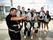 22 July 2024; Airport security intervenes while Team Ireland boxers, back row, from left, Jack Marley, Dean Clancy, Jude Gallagher, Grainne Walsh, Aoife O'Rourke and Daina Moorhouse, and front row, from left, Michaela Walsh, and Jennifer Lehane, pose for a photograph during their arrival at Charles de Gaulle airport in Paris ahead of the 2024 Paris Summer Olympic Games in Paris, France. Photo by Stephen McCarthy/Sportsfile