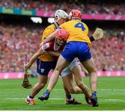 21 July 2024; Alan Connolly of Cork in action against Adam Hogan, left, and Conor Leen, 4, of Clare during the GAA Hurling All-Ireland Senior Championship Final between Clare and Cork at Croke Park in Dublin. Photo by Stephen McCarthy/Sportsfile