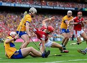21 July 2024; Alan Connolly of Cork in action against Adam Hogan and Conor Leen, left, of Clare during the GAA Hurling All-Ireland Senior Championship Final between Clare and Cork at Croke Park in Dublin. Photo by Stephen McCarthy/Sportsfile