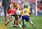 21 July 2024; Evan Diggin, Scoil Chríost Rí, Tralee, Kerry, representing Cork in action against Conrad Healy, St Patrick's NS, Cary, Sligo, representing Clare and Cathal Lyons, Scoil Mhuire na nGael, Dundalk, Louth, representing Clare, 8, during the GAA INTO Cumann na mBunscol Respect Exhibition Go Games at the GAA Hurling All-Ireland Senior Championship final between Clare and Cork at Croke Park in Dublin. Photo by Piaras Ó Mídheach/Sportsfile