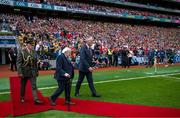 21 July 2024; President of Ireland Michael D Higgins and Uachtarán Chumann Lúthchleas Gael Jarlath Burns make their way to meet the teams before the GAA Hurling All-Ireland Senior Championship Final between Clare and Cork at Croke Park in Dublin. Photo by Brendan Moran/Sportsfile
