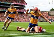 21 July 2024; Peter Duggan of Clare, 12, and team-mate Tony Kelly in action against Tim O'Mahony of Cork during the GAA Hurling All-Ireland Senior Championship Final between Clare and Cork at Croke Park in Dublin. Photo by Piaras Ó Mídheach/Sportsfile