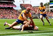 21 July 2024; Peter Duggan of Clare in action against Tim O'Mahony of Cork during the GAA Hurling All-Ireland Senior Championship Final between Clare and Cork at Croke Park in Dublin. Photo by Piaras Ó Mídheach/Sportsfile