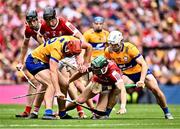 21 July 2024; Mark Coleman of Cork in action against Peter Duggan, left, and Aidan McCarthy of Clare during the GAA Hurling All-Ireland Senior Championship Final between Clare and Cork at Croke Park in Dublin. Photo by Piaras Ó Mídheach/Sportsfile