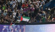 24 July 2024; Spectators wave Palestine flags during the Men's Football Pool D match between Team Mali and Team Israel at the Parc des Princes during the 2024 Paris Summer Olympic Games in Paris, France. Photo by Brendan Moran/Sportsfile