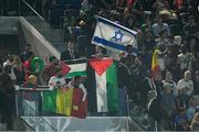 24 July 2024; Palestine and Israel flags in the crowd during the Men's Football Pool D match between Team Mali and Team Israel at the Parc des Princes during the 2024 Paris Summer Olympic Games in Paris, France. Photo by Brendan Moran/Sportsfile