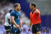 25 July 2024; Antoine Dupont of Team France speaks to referee AJ Jacobs during the Men's Rugby Sevens Pool C match between Team Fiji and Team France at the Stade de France during the 2024 Paris Summer Olympic Games in Paris, France. Photo by Brendan Moran/Sportsfile