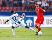 25 July 2024; JJ Lunney of Shelbourne in action against Ifeanyi Onyedika of FC Zurich during the UEFA Conference League second qualifying round first leg match between FC Zurich and Shelbourne at Stadion Letzigrund in Zurich, Switzerland. Photo by Vedran Galijas/Sportsfile