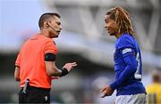 25 July 2024; Referee Ishmael Barbara with Saimon Nadélia Bouabré of France during the UEFA European U19 Championship semi-final match between France and Ukraine at National Football Stadium at Windsor Park in Belfast, Northern Ireland. Photo by Ben McShane/Sportsfile