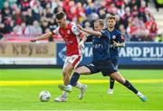 25 July 2024; Mason Melia of St Patrick's Athletic in action against Mats Hammerich of FC Vaduz during the UEFA Conference League second qualifying round first leg match between St Patrick's Athletic and FC Vaduz at Richmond Park in Dublin. Photo by Matt Browne/Sportsfile