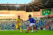 25 July 2024; Mathis Amougou of France in action against Ramik Hadzhyiev of Ukraine during the UEFA European U19 Championship semi-final match between France and Ukraine at National Football Stadium at Windsor Park in Belfast, Northern Ireland. Photo by Ben McShane/Sportsfile