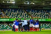 25 July 2024; France players and staff huddle after the UEFA European U19 Championship semi-final match between France and Ukraine at National Football Stadium at Windsor Park in Belfast, Northern Ireland. Photo by Ben McShane/Sportsfile