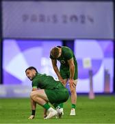 25 July 2024; Terry Kennedy, right, and Andrew Smith of Team Ireland after defeat in the Men's Rugby Sevens Quarter-Final match between Team Fiji and Team Ireland at the Stade de France during the 2024 Paris Summer Olympic Games in Paris, France. Photo by Brendan Moran/Sportsfile