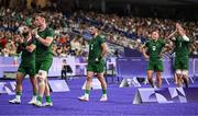 25 July 2024; Team Ireland players, from left, Mark Roche, Zac Ward, Andrew Smith, Hugo Lennox and Jack Kelly leave the field of play after defeat in the Men's Rugby Sevens Quarter-Final match between Team Fiji and Team Ireland at the Stade de France during the 2024 Paris Summer Olympic Games in Paris, France. Photo by Brendan Moran/Sportsfile