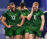 25 July 2024; Team Ireland players Niall Comerford, 12, and Gavin Mullin after defeat in the Men's Rugby Sevens Quarter-Final match between Team Fiji and Team Ireland at the Stade de France during the 2024 Paris Summer Olympic Games in Paris, France. Photo by Brendan Moran/Sportsfile