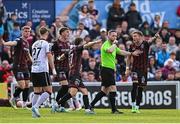 26 July 2024; Bohemians players remonstrate with referee Eoghan O'Shea during the SSE Airtricity Men's Premier Division match between Bohemians and Dundalk at Dalymount Park in Dublin. Photo by Seb Daly/Sportsfile