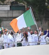 26 July 2024; Team Ireland, led by flagbearers Shane Lowry and Sarah Lavin, during the Opening Ceremony of the 2024 Paris Summer Olympic Games on the banks of the river Seine in Paris, France. Photo by Stephen McCarthy/Sportsfile